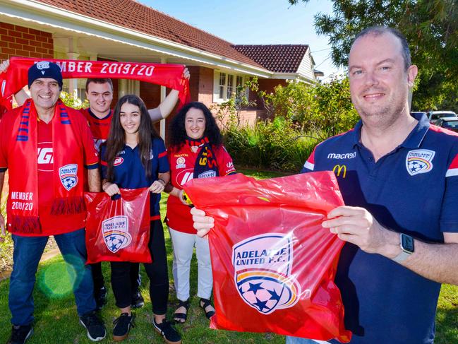 Adelaide United chairman Piet van der Pol delivering goodies to Reds members Nick Tsokkos, daughter Antonia, son Mos and wife Nicky of West Beach, April 9, 2020. (Photo: Brenton Edwards)