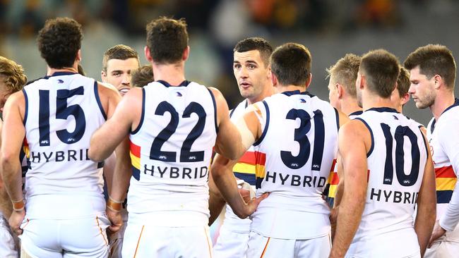 Taylor Walker speaks to the Crows at half-time of their 56-point loss to the Hawks. Picture: Michael Dodge/Getty Images