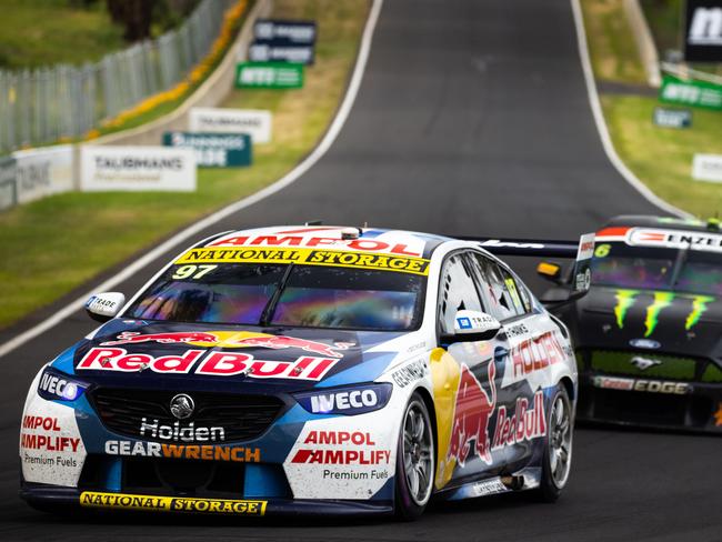 BATHURST, AUSTRALIA - OCTOBER 18: (EDITORS NOTE: A polarizing filter was used for this image.) Shane van Gisbergen drives the #97 Red Bull Holden Racing Team Holden Commodore ZB leads  Cameron Waters drives the #6 Monster Energy Racing Ford Mustan during the Bathurst 1000 at Mount Panorama on October 18, 2020 in Bathurst, Australia. (Photo by Daniel Kalisz/Getty Images)