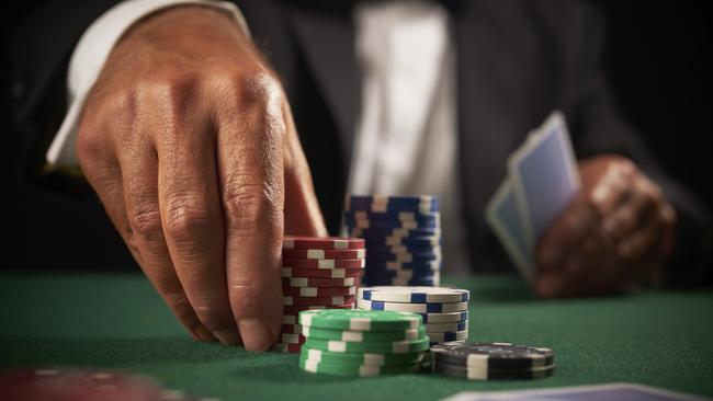 card player gambling casino chips on green felt background selective focus