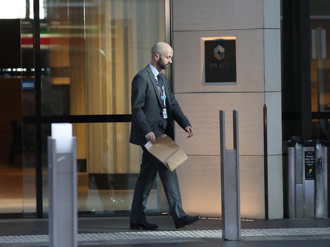 A detective leaves the hotel this morning. Picture: David Swift