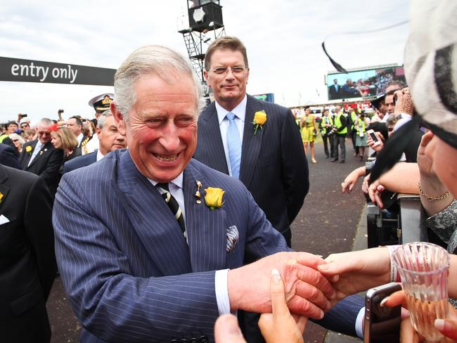 Prince Charles greets people during his visit to Flemington in 2012.