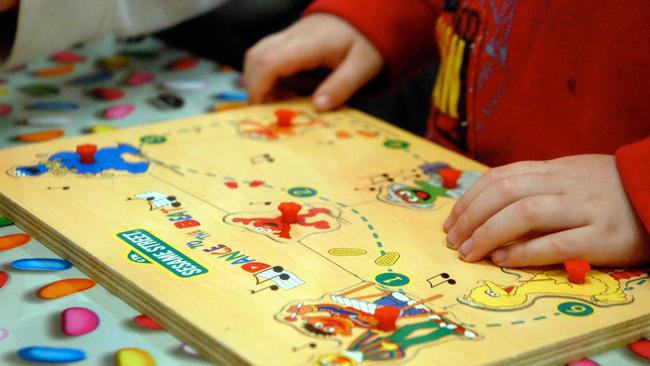 Undated : Young child at at Child Care Centre playing with a Sesame Street jigsaw puzzle.