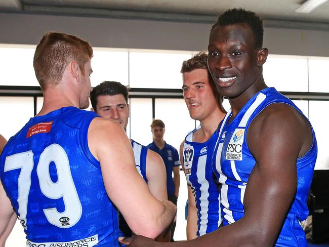 Ryan Morrison (right) with Majak Daw after a Roos VFL game this year.