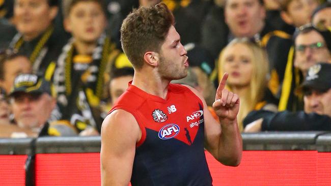 Tomas Bugg gestures to Tigers supporters in the crowd after kicking a goal. Picture: Getty