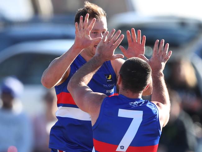 Mornington’s Will Goosey (left) celebrates with teammate Anthony Giuliano after slotting a goal. Picture: David Crosling