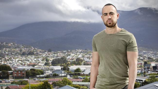 Alex is a Brighton property owner who is owed $6k in rent. He is a support worker who for the past 3-4 months has been working an extra 20-30 hours a fortnight to cover the loss. Picture Chris Kidd