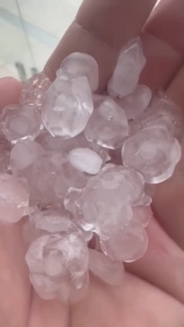 Giant hail and torrential rain as storms slam Gold Coast