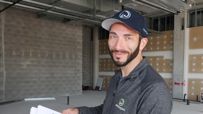 Australian CEO Sam Mustaca inspects the Wahlburgers site in Surfers Paradise. Picture Glenn Hampson