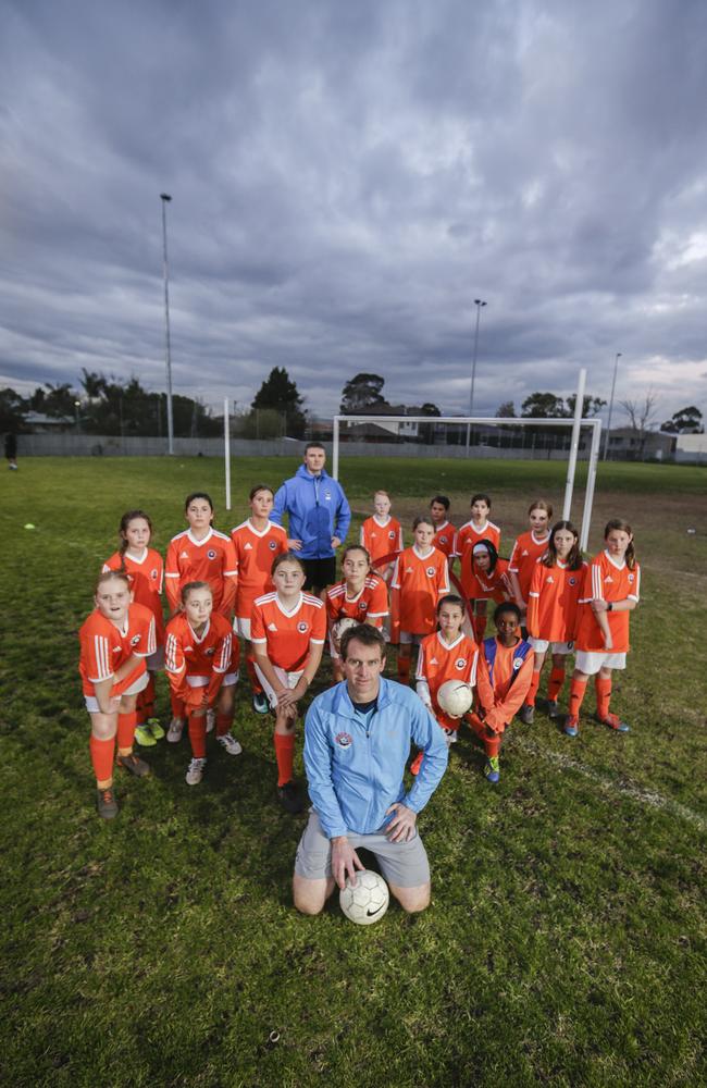 Derick Berends and Denis Gough with some of the kids at training in Parkdale. Picture: Valeriu Campan