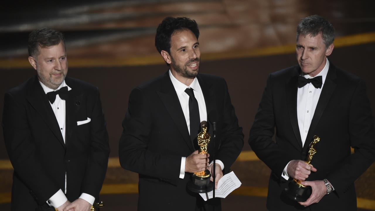 Best Visual Effects: <i>1917</i>. From left; Greg Butler, Guillaume Rocheron and Dominic Tuohy accept the award. Picture: AP