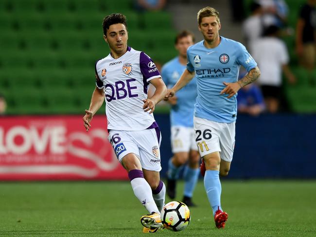 Young gun Jacob Italiano wins the ball from Luke Brattan.