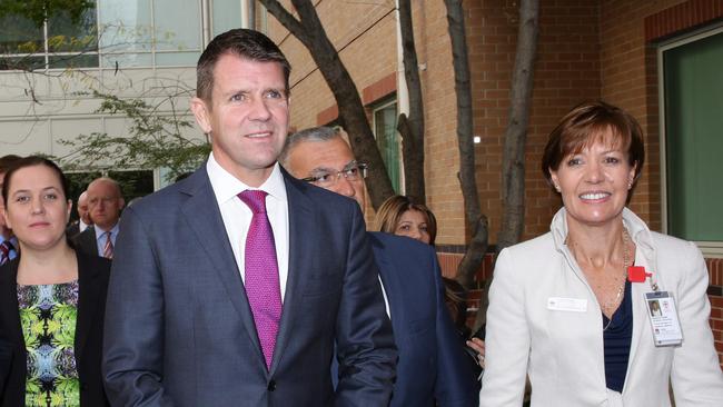 Mike Baird walks through Liverpool Hospital’s Anzac Courtyard before making the announcement. Picture: Robert Pozo