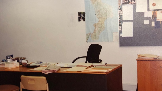 Inside Mario Condello's office, with happy snaps and a certificate pinned to the wall and