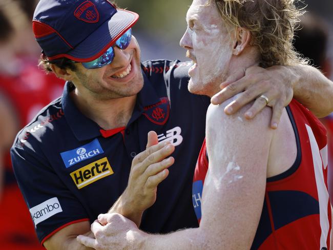 NCA. MELBOURNE, AUSTRALIA. 22nd February, 2025 . North Melbourne vs Melbourne at Arden St Oval.   Christian Petracca gives Clayton Oliver a hug at qtr time    .  Picture: Michael Klein