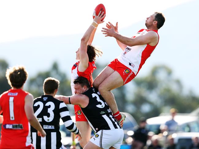 Action from TSL game between Clarence v Glenorchy from Richmond Oval. Clarence's Sam Green marks in front of teammate Jason Bailey and Glenorchy's Daniel Coppleman. Picture: Zak Simmonds