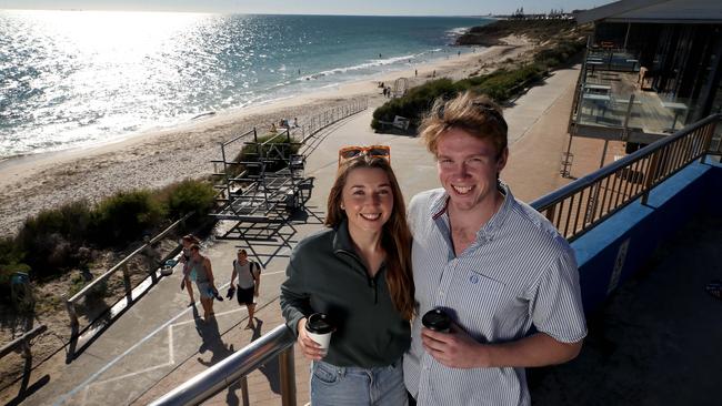 Madeline Avis and David Dixon grab a coffee at Cottesloe Beach on Sunday. Picture: Colin Murty