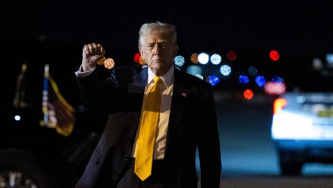 US President Donald Trump pumps his fist after stepping off Air Force One at Palm Beach International Airport in West Palm Beach, Florida. Picture: AFP