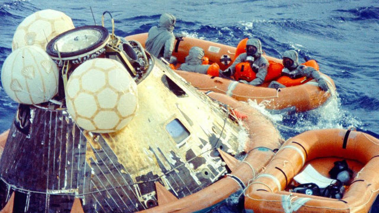The Apollo 11 crew in isolation suits after splashdown in the ocean near Hawaii in July 1969. Picture: NASA