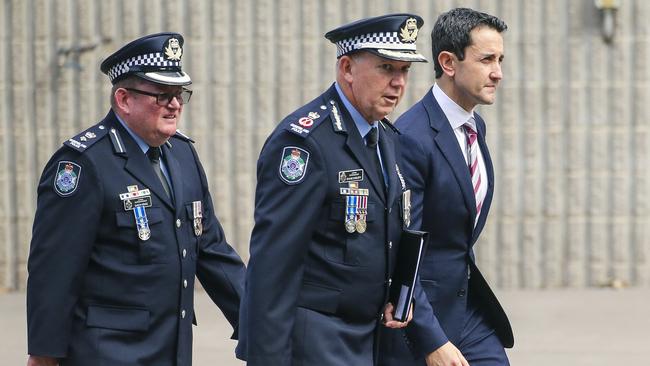 Premier David Crisafulli with senior police on Friday. Picture: Glenn Campbell
