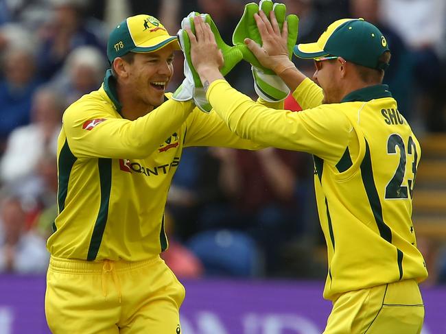 D’Arcy Short says former national captain Tim Paine (L) helped engineer his switch to Adelaide. Picture: AFP PHOTO / Geoff CADDICK.