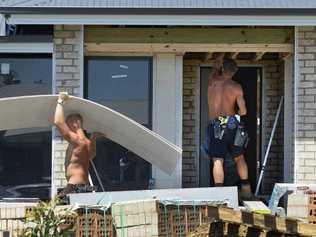 MOVING IN: Builders keep busy at Golf Links Estate at Leichhardt as the first three stages released a year ago sell out. Picture: Rob Williams