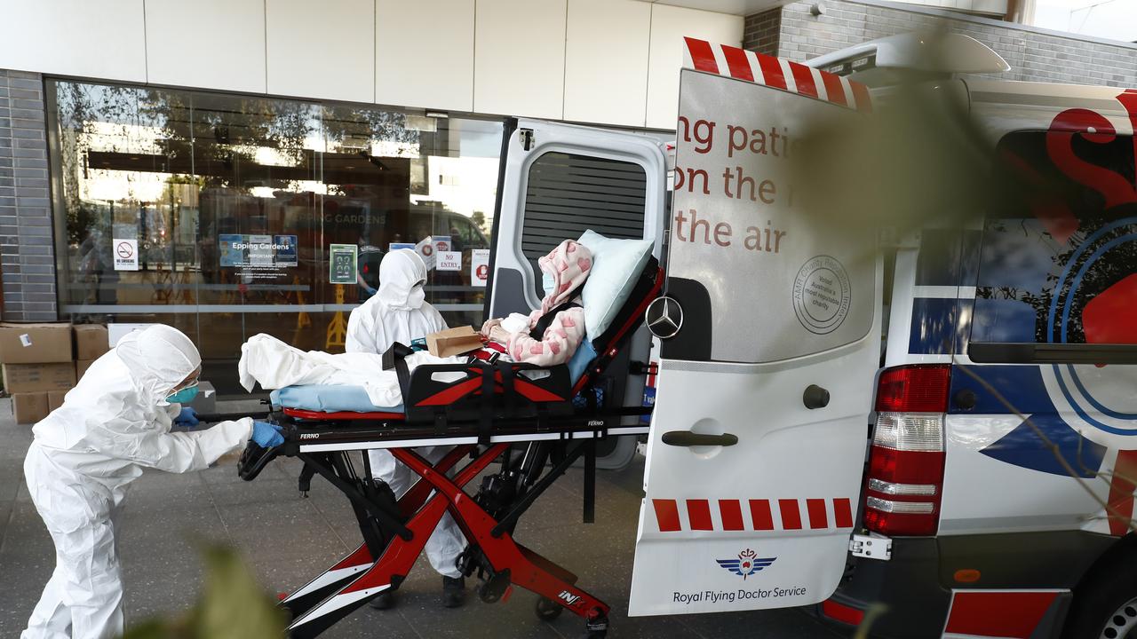 A resident of Epping Gardens Aged Care Facility is taken away in an ambulance today. Picture: Getty Images