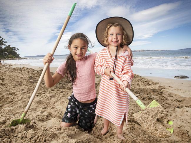 Amira Page, 8, and Sophia Sari, 4, trying their luck at Hinsby Beach. Picture: Chris Kidd