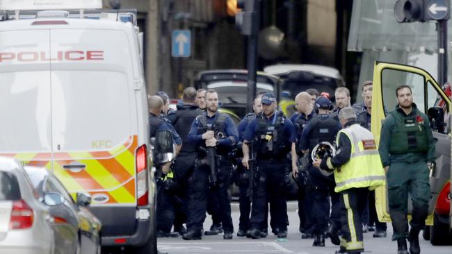 Armed British police officers within a cordoned off area after an attack at London Bridge. Picture: AP Photo/Matt Dunham