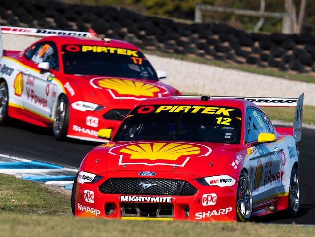 Fabian Coulthard leads Scott McLaughlin at the head of the field in their Ford Mustangs.