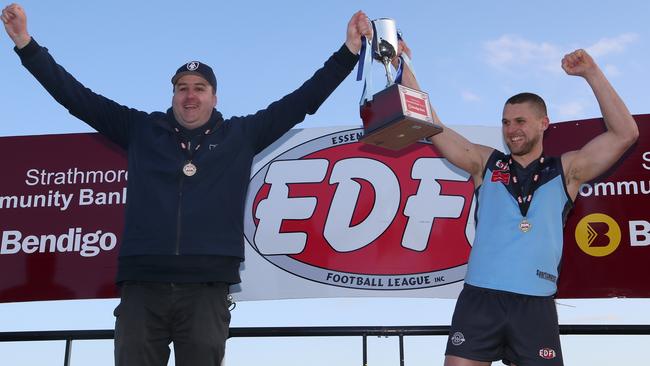 Aberfeldie coach Adam Potter and captain Luke Davis celebrate with the trophy after EDFL footy grand final: Aberfeldie v Greenvale at Windy Hill on Saturday, September 16, 2017, in Essendon, Victoria, Australia.Picture: Hamish Blair