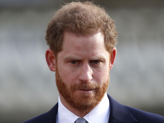 FILE -  Britain's Prince Harry, Duke of Sussex watches children play rugby league prior to the draw for the Rugby League World Cup 2021 at Buckingham Palace in London on January 16, 2020. (Photo by Adrian DENNIS / AFP)