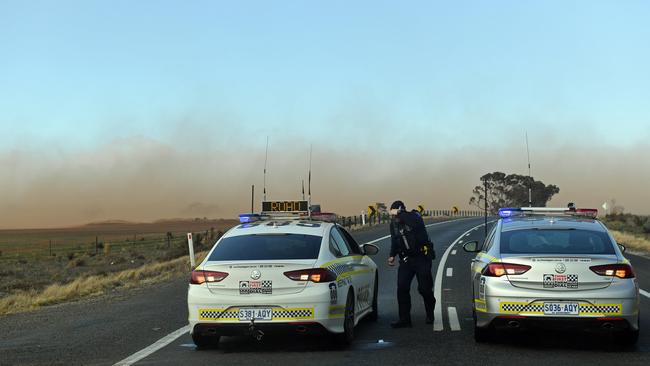 Police on the Sturt Highway were unable to get near the scene of the crash because of the dust storm. Picture: Tom Huntley