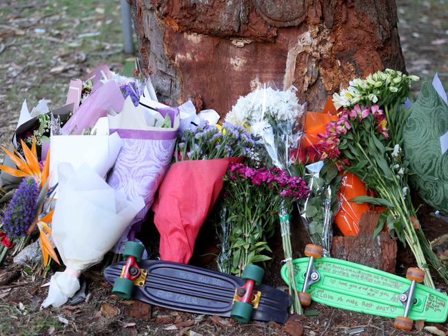 Flowers and tributes left at the crash scene on Cabbage Tree Road, Bayview on Saturday. Picture: Damian Shaw