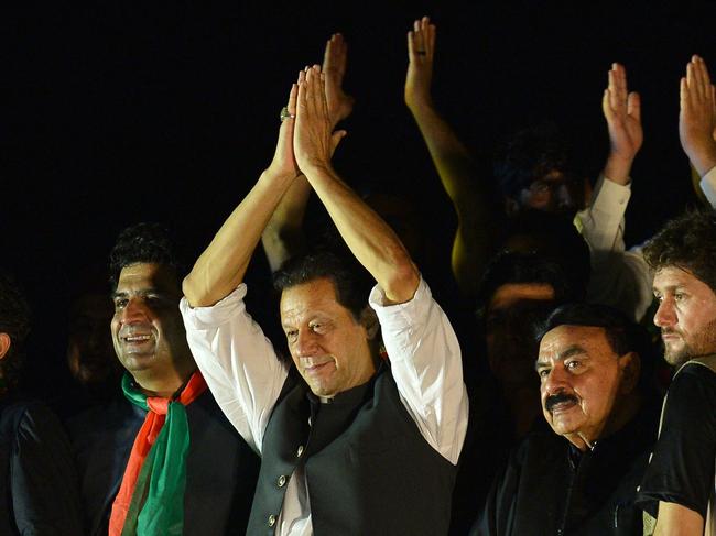 Pakistan's former Prime Minister and leader of the Pakistan Tehreek-e-Insaf party (PTI) Imran Khan, speaks during an anti-government protest rally in Islamabad on August 20, 2022. (Photo by Farooq NAEEM / AFP)