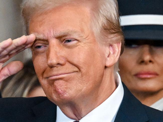 TOPSHOT - President Donald Trump and Melania Trump during the inauguration of Donald Trump as the 47th president of the United States takes place inside the Capitol Rotunda of the U.S. Capitol building in Washington, D.C., Monday, January 20, 2025. It is the 60th U.S. presidential inauguration and the second non-consecutive inauguration of Trump as U.S. president. (Photo by Kenny Holston/The New York Times / AFP)