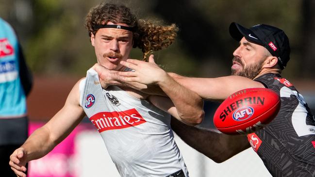 Harry Demattia and Steele Sidebottom in a contest at Collingwood training. (Photo by Asanka Ratnayake/Getty Images)