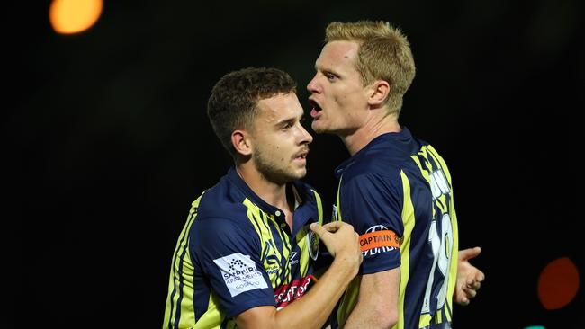 GOSFORD, AUSTRALIA - FEBRUARY 22: Matt Simon of the Central Coast Mariners is restrained by team mate Jordan Murray after getting sent off during the Round 20 A-League Match between the Central Coast Mariners and Brisbane Roar FC at Central Coast Stadium on February 22, 2019 in Gosford, Australia. (Photo by Tony Feder/Getty Images)