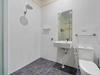 Tiny home has glass toilet in kitchen