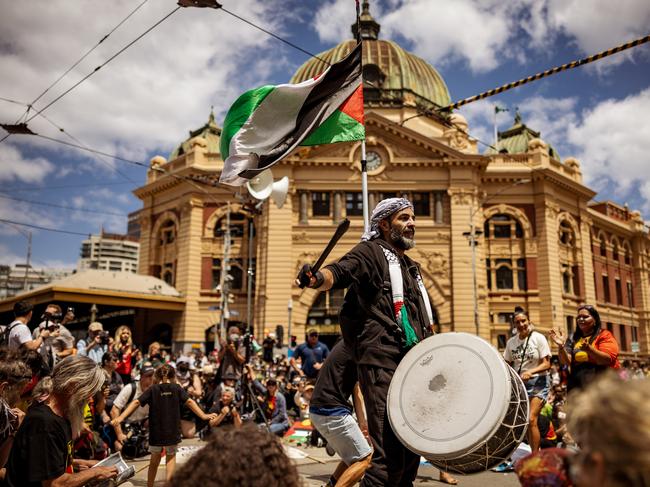 MELBOURNE, AUSTRALIA - JANUARY 26: Palestinian men join in solidarity with Aboriginal people during the Invasion Day Rally on January 26, 2024 in Melbourne, Australia. Australia Day, formerly known as Foundation Day, is the official national day of Australia and is celebrated annually on January 26 to commemorate the arrival of the First Fleet to Sydney in 1788. Many indigenous Australians refer to the day as 'Invasion Day' and there is a growing movement to change the date to one which can be celebrated by all Australians. In 2024, supermarket Chains Woolworths and Aldi announced that they would stop stocking themed merchandise for the day, drawing a political backlash from opposition leader Peter Dutton. (Photo by Tamati Smith/Getty Images) *** BESTPIX ***