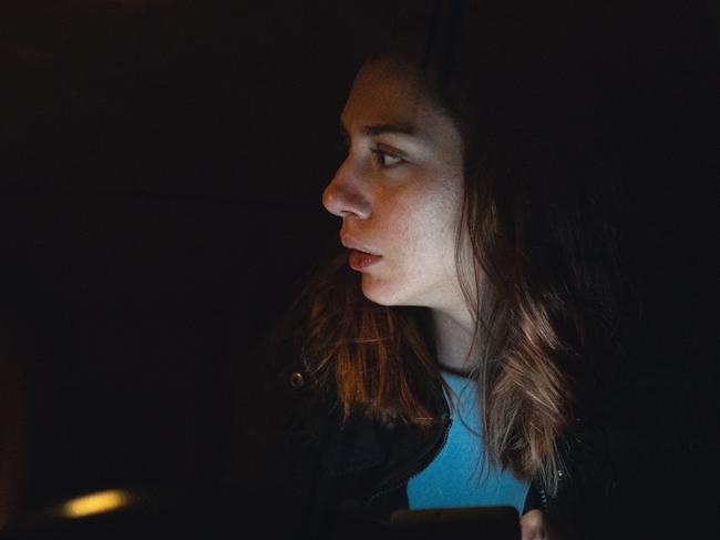 Mentally abused woman sitting in her car after running away from her partner in car domestic violence scared istock