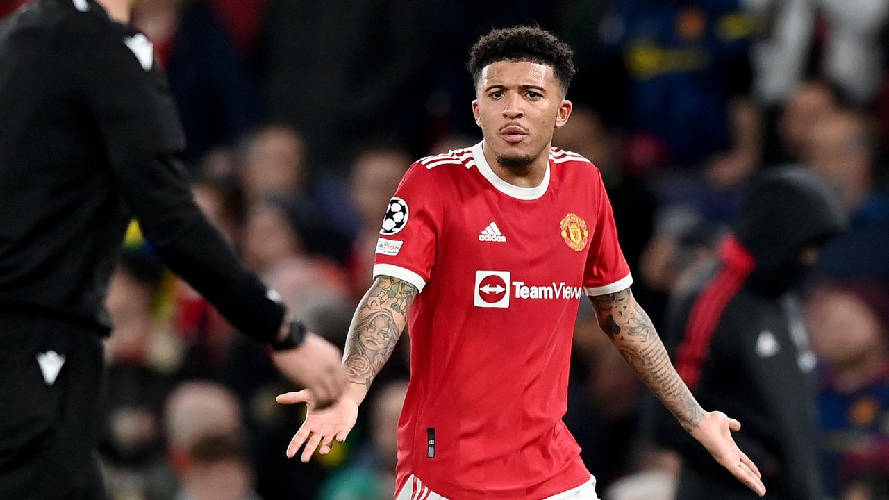 MANCHESTER, ENGLAND – MARCH 15: Jadon Sancho of Manchester United complains to the Referee Slavko Vincic after their sides defeat during the UEFA Champions League Round Of Sixteen Leg Two match between Manchester United and Atletico Madrid at Old Trafford on March 15, 2022 in Manchester, England. (Photo by Shaun Botterill/Getty Images)