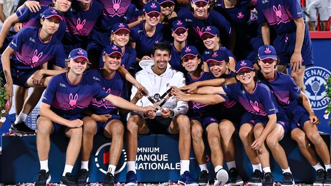 Alexei Popyrin poses with the ball persons after defeating Andrey Rublev. (Photo by Minas Panagiotakis/Getty Images)