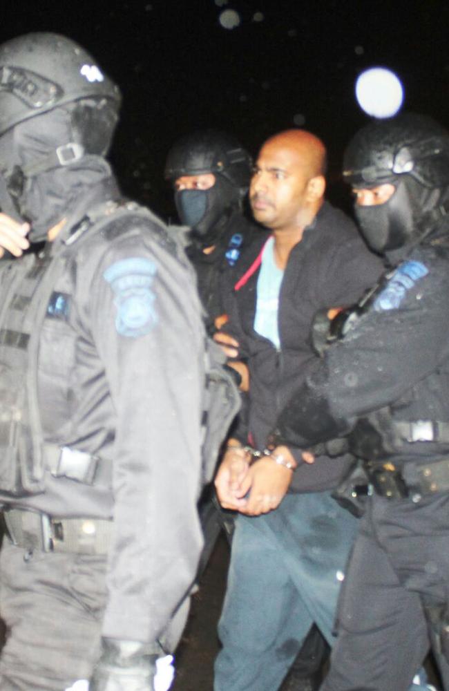 Bali Nine ringleader Myuran Sukumaran under police guard during his transfer for execution on ‘Death Island’.