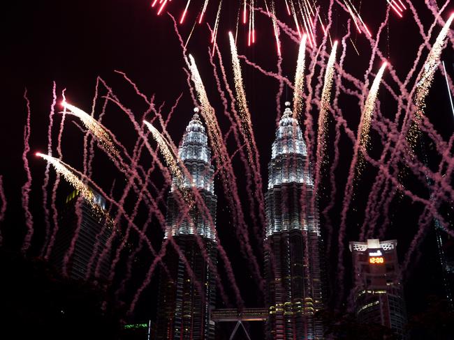 Fireworks explode in front of Malaysia's landmark building, the Petronas Twin Towers. Picture: AP