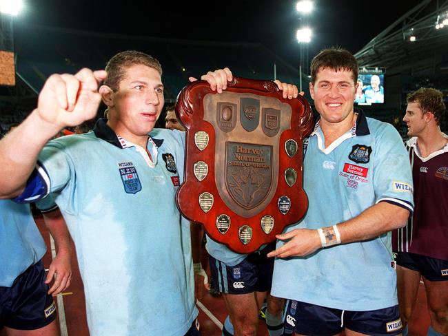 Bryan Fletcher and Jason Stevens celebrate with the State of Origin Shield in 2000. Picture: NRL Photos