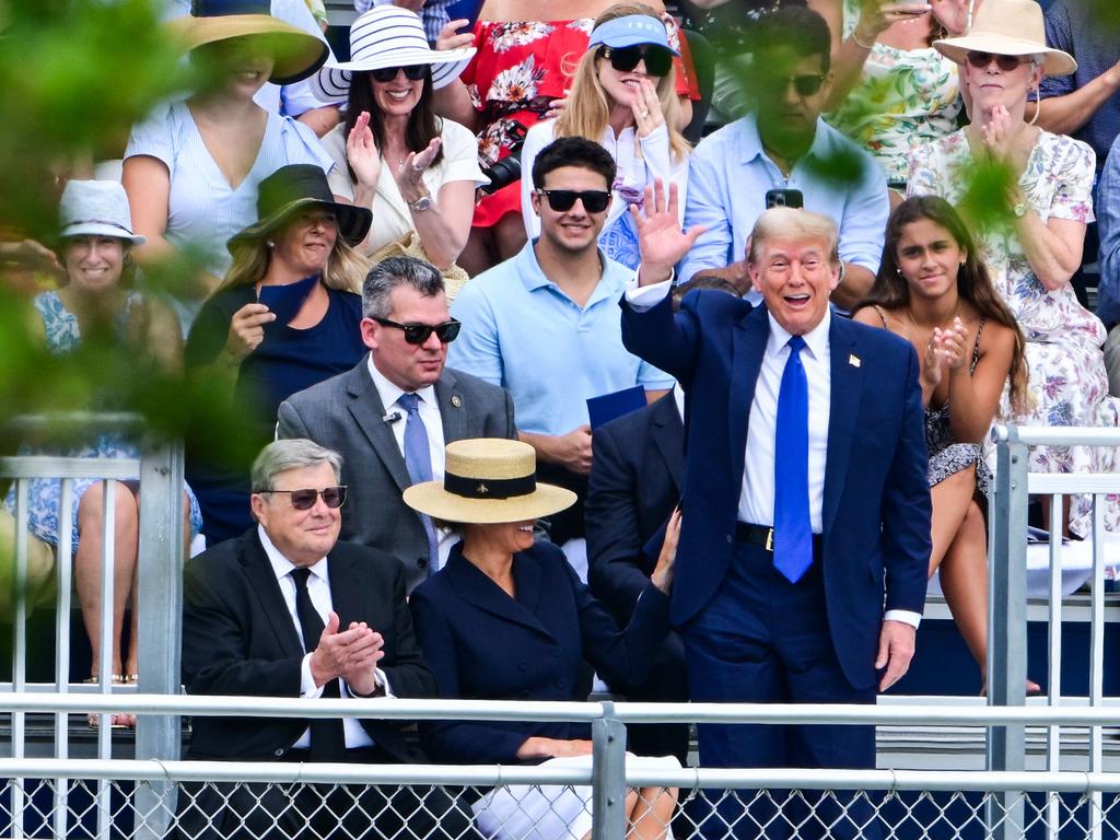 The former US President was joined by wife Melania, who wore a straw hat and blue suit jacket. Picture: Giorgio VIERA / AFP