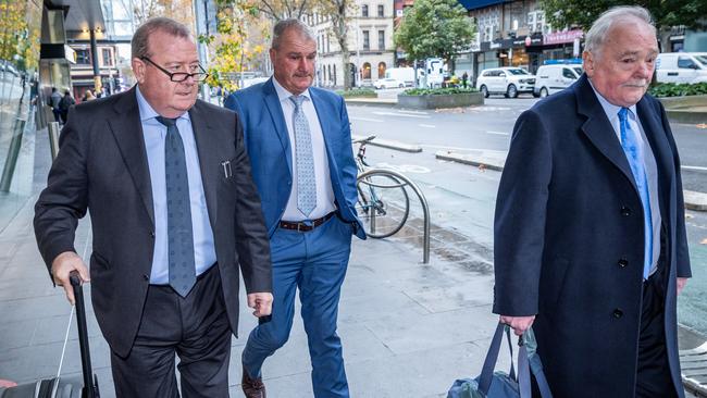 Weir (centre) with his legal team on Monday. Picture: Jake Nowakowski