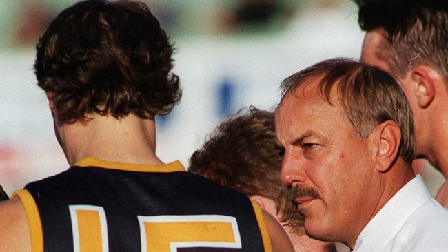 Getting the message across ... Crows coach Malcolm Blight talks to ruckman David Pittman during a match in 1997.