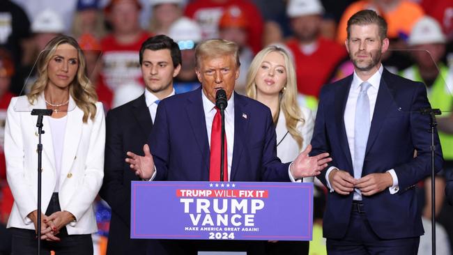 Lara Trump (L) watches Donald Trump as he speaks at a campaign rally prior to the US election. Picture: AFP.